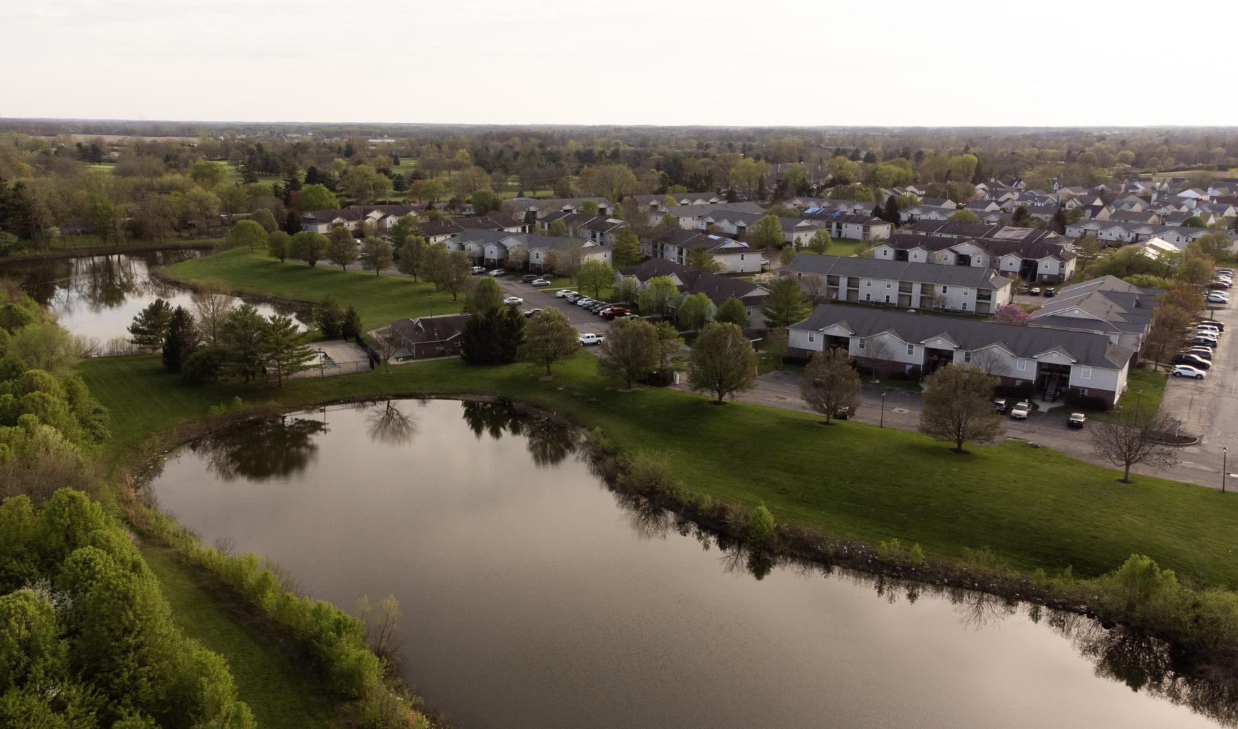 a river with a small town in the background