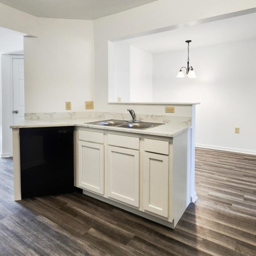 a kitchen with white cabinets