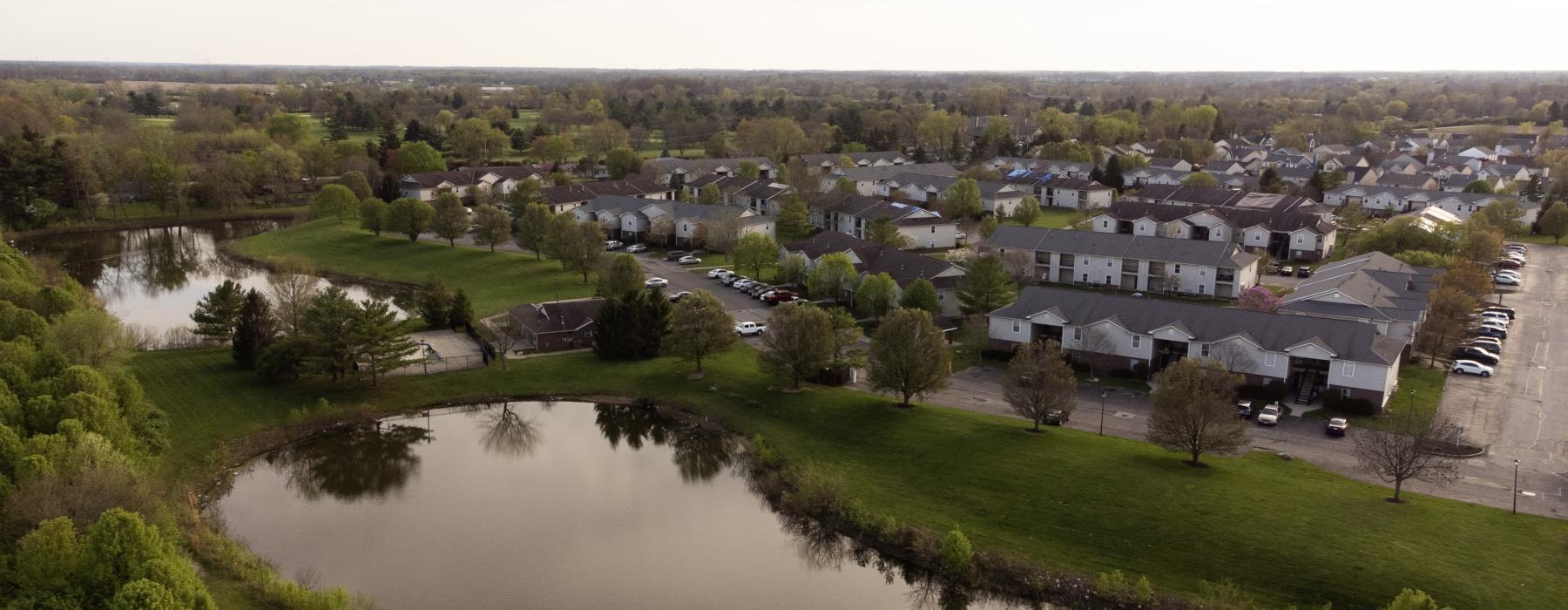 a river with a small town in the background