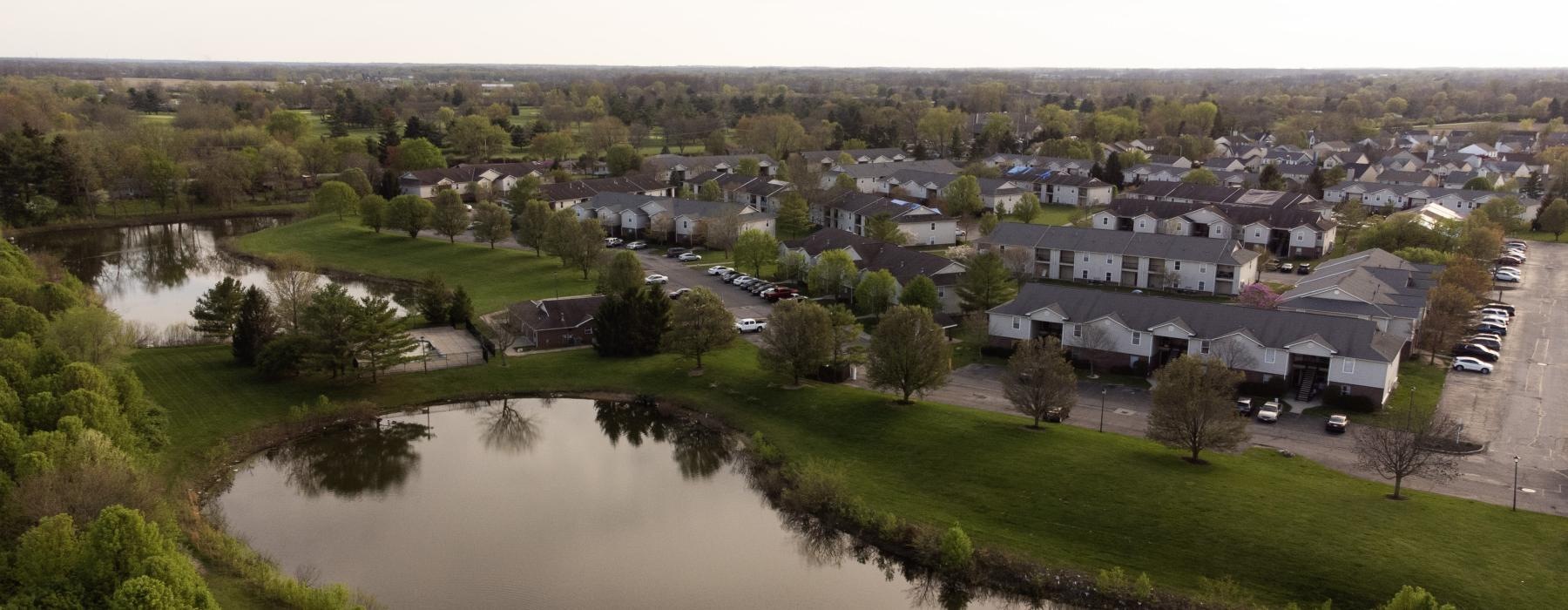 a river with a small town in the background